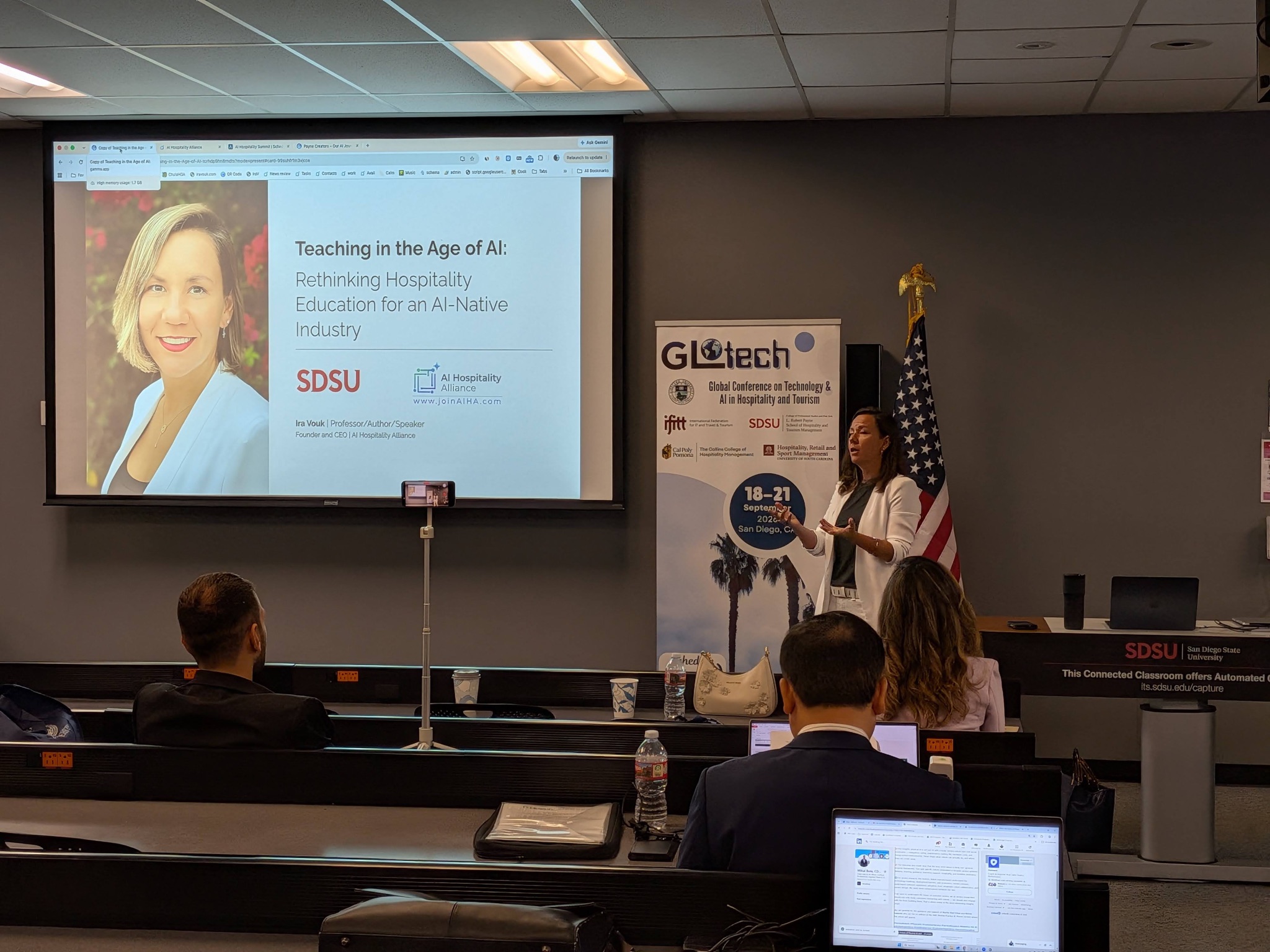 Ira Vouk presenting "Teaching in the Age of AI" keynote at GLOTECH 2026, San Diego State University